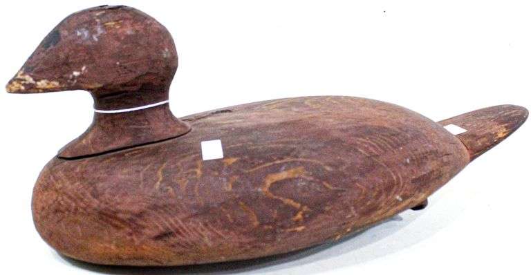 Folk Art wooden duck decoy , Barn Red paint , Rusty horseshoe weight , Strangely attractive