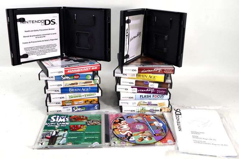 Collection of Nintendo DS Game Cases. Includes Mario Kart DS, Sims ...