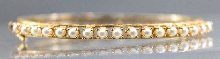 14 KT Gold hinged Bangle Bracelet accented with genuine Pearls. (10.4 gm t.wt)