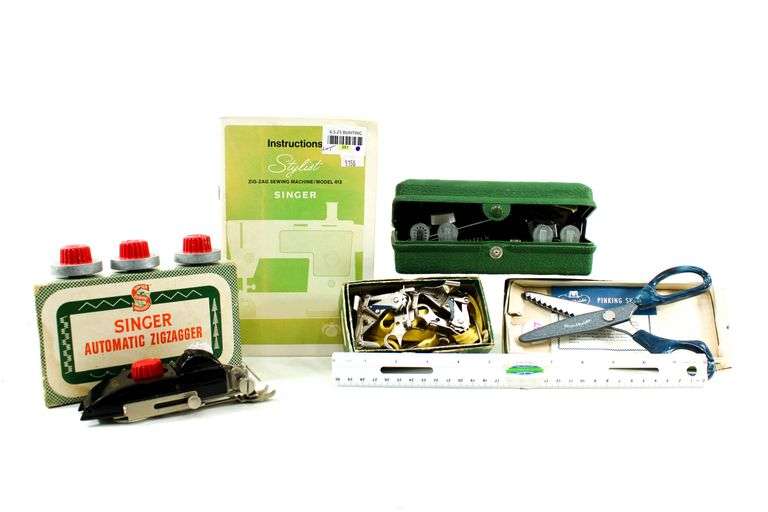 Singer Sewing Machine- Accessories for vintage Singer Sewing Machine, including Zig-Zag instruction manual, Automatic Zig-Zagger, Pinking Shears, and attachments.