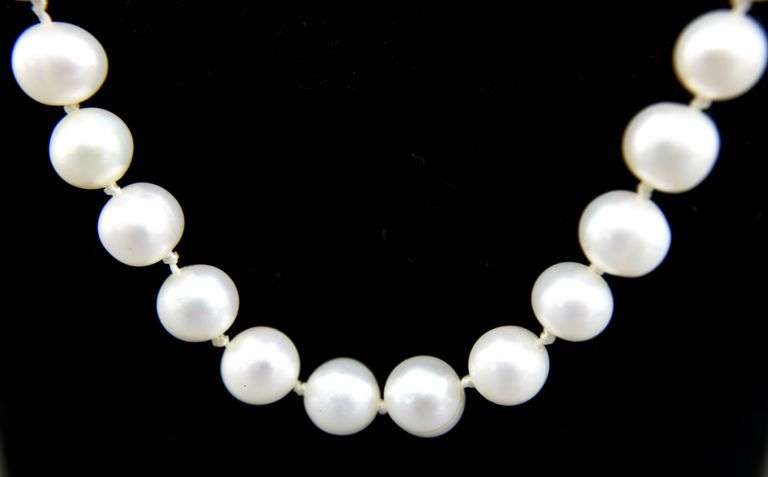 Sterling Silver findings on a knotted genuine Pearl Necklace, 18"