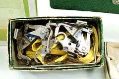 Singer Sewing Machine- Accessories for vintage Singer Sewing Machine, including Zig-Zag instruction manual, Automatic Zig-Zagger, Pinking Shears, and attachments.