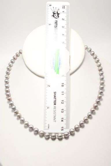 Sterling Silver findings on a genuine, knotted, Pearl Necklace,  16"