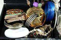 Jewelry and jewelry parts, in a leather travel display case.