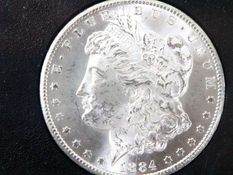1884 "CC" Morgan silver Dollar In the 1976 release box and case