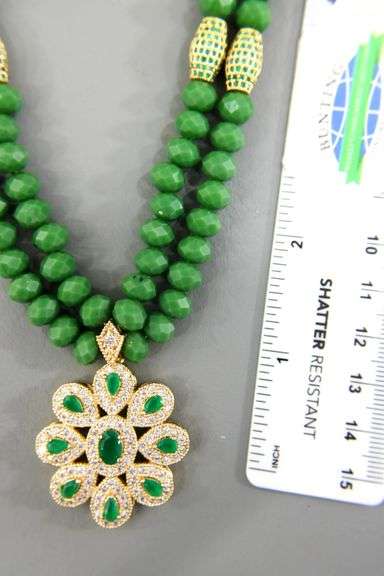 Necklace of emerald green faceted beads with a gorgeous dazzling Pendant.