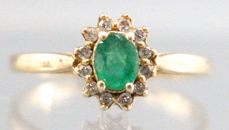 14KT Gold, Diamond, and Emerald (both tested) Ring. 2.2g. Size 7.5.