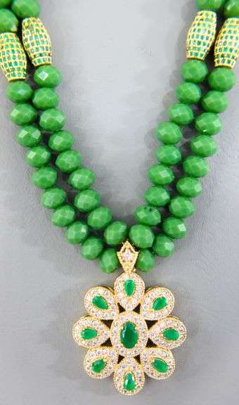 Necklace of emerald green faceted beads with a gorgeous dazzling Pendant.