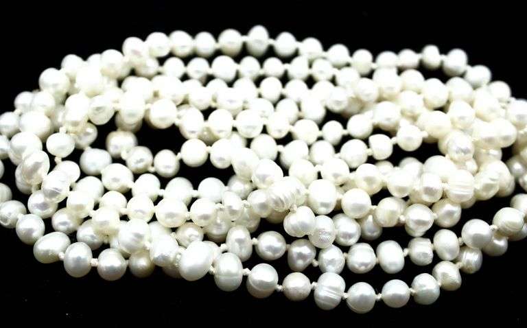 Genuine Pearls, 60" strand of pearls.