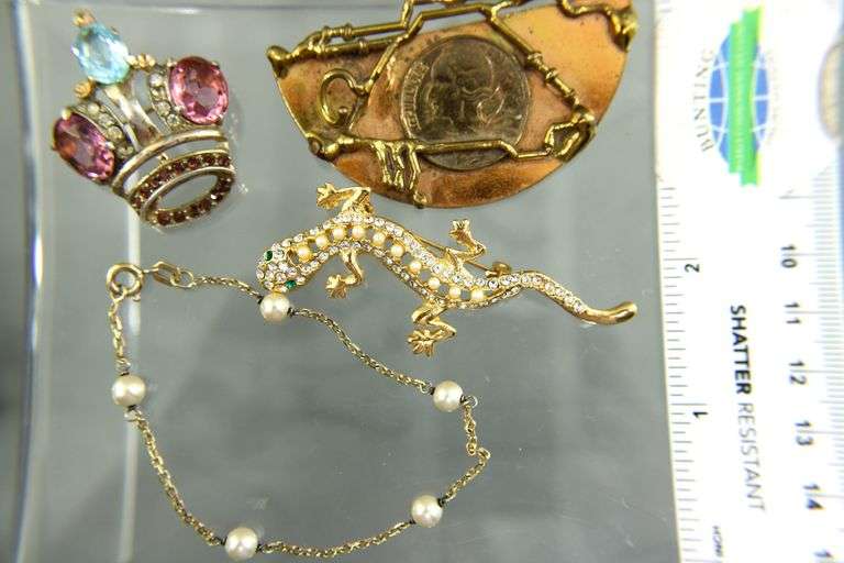 Unusual hand wrought copper Brooch with a French coin, signed by the artist.   Gilt Sterling Silver Pearl station Bracelet;  Sterling Silver crown Brooch.  And a glistening  little lizard.