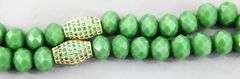 Necklace of emerald green faceted beads with a gorgeous dazzling Pendant.