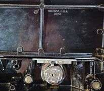 1930s/1940s Singer Featherweight. Serial number AF080436. Catalog 3-110 | 700 Black & Gold Sewing Machine with Case, Manual, and Accessories - Consignor contributes last serviced 7/16/2025 "Works Great"