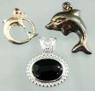 Sterling Silver Dolphin Pendants,  an oval Onyx Sterling Pendant and a Sterling buckle Ring, size 5