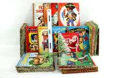Vintage Young Readers Books.  Walt Disney's Jiminy Cricket Fire Fighter A Mickey Mouse Club Book, The three billy Goats Gruff, A Little Golden Book "Lassie" and the daring Rescue, Annie Oakley Sharpshooter & More. FRONT LEFT WALL