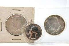 1964 Kennedy silver half dollars and a 1943 Washington Silver Quarter