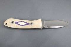 Dozier , Arkansas made custom folding knife ,  D2 marked blade with Bone scales with inlayed fossil coral ? , circa 2002