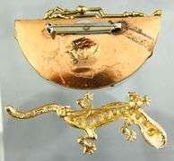 Unusual hand wrought copper Brooch with a French coin, signed by the artist.   Gilt Sterling Silver Pearl station Bracelet;  Sterling Silver crown Brooch.  And a glistening  little lizard.