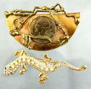 Unusual hand wrought copper Brooch with a French coin, signed by the artist.   Gilt Sterling Silver Pearl station Bracelet;  Sterling Silver crown Brooch.  And a glistening  little lizard.