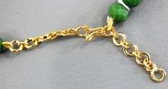 Necklace of emerald green faceted beads with a gorgeous dazzling Pendant.