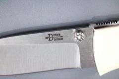 Dozier , Arkansas made custom folding knife ,  D2 marked blade with Bone scales with inlayed fossil coral ? , circa 2002