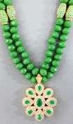 Necklace of emerald green faceted beads with a gorgeous dazzling Pendant.