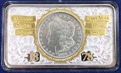 1878 Morgan silver dollar first year of issue tribute in case