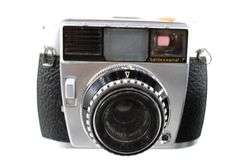Vintage Cameras:  Baldessamat-F 35mm Film Camera (Made 1958 to 1967) - and - Ricoh Twin Lens Reflex Camera Seikosha-SLV 120 Film - and - Yashica Electro 8 YXL-Zoom 25 Magnetic Release Silent Super 8 (Marketed 1974)