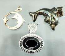 Sterling Silver Dolphin Pendants,  an oval Onyx Sterling Pendant and a Sterling buckle Ring, size 5