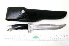 Buck Model 120 fixed blade hunting knife with leather scabbard , Appears to have never been used or resharpened