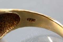 10KT Gold and Diamond (tested) Ring. 7g.  Size 9.5