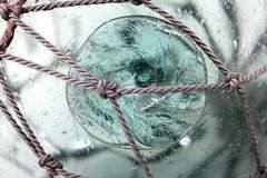 Vintage Glass Fishing Float Aquamarine Netted.
