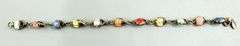 Sterling Silver and 14 KTGF Bracelet of enameled double sided lady bugs, 7"