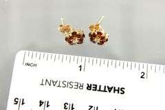 14 KT Gold Earrings and backs, set with red Tourmaline.     (1.35 gm t.wt)