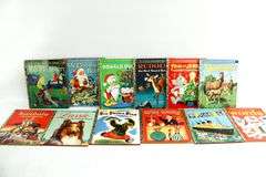 Vintage Young Readers Books.  Walt Disney's Jiminy Cricket Fire Fighter A Mickey Mouse Club Book, The three billy Goats Gruff, A Little Golden Book "Lassie" and the daring Rescue, Annie Oakley Sharpshooter & More. FRONT LEFT WALL