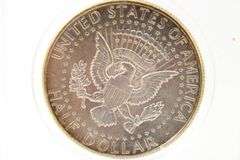 1964 Kennedy silver half dollars and a 1943 Washington Silver Quarter