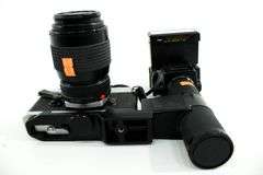 Canon FTb QL 35mm SLR Film Camera with Canon FD mount lens and an External Flash Unit.