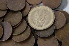 300 Wheat Pennies, three 1976 Eisenhower Dollars, 4 "gold" dollars , 2 Susan B Anthony dollars and more a