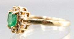 14KT Gold, Diamond, and Emerald (both tested) Ring. 2.2g. Size 7.5.