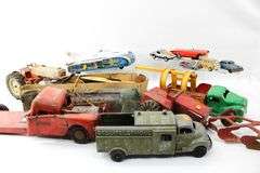 Vintage Toys:  Hubley Metal Toy Ford Tractor - and - Hornby Wind-Up Speed Boat with Distressed Box - and - Structo Fireball Motor - and - 1940s Banner Pressed Steel Toy Tow Truck Banner Wrecking Service #1141 Found as Rare - and - 1960s Lemezaru Gyar Holdauto Atomic Race Car Rocket Tin Litho Toy Made in Hungary - and - More