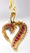 14KT Gold, Diamond, and Ruby (both tested) Pendant and 14KT Gold Necklace.  7gtw.