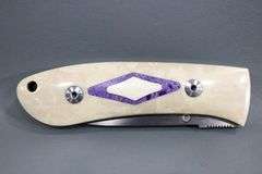 Dozier , Arkansas made custom folding knife ,  D2 marked blade with Bone scales with inlayed fossil coral ? , circa 2002