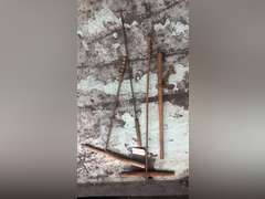 LOG ROLLER, WOODEN HANDLE DRILLS, AND A BRANDING IRON