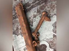 LOG ROLLER, WOODEN HANDLE DRILLS, AND A BRANDING IRON