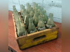 ASSORTED COKE BOTTLES AND CRATE (24 TOTAL)
