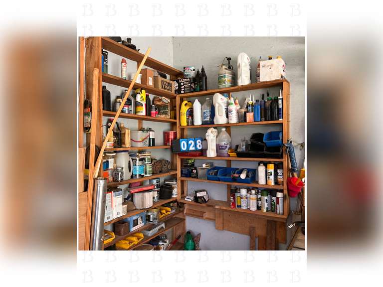 A lot of miscellaneous lubricant, pesticides, chemicals, and hardware. Shelf comes with.