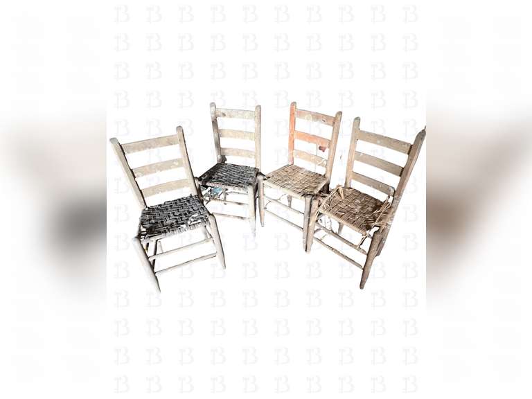 A lot of four vintage wooden chairs