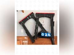 A pair of sawhorses, a 8ft ladder, and construction light with stand.