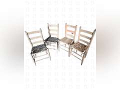 A lot of four vintage wooden chairs