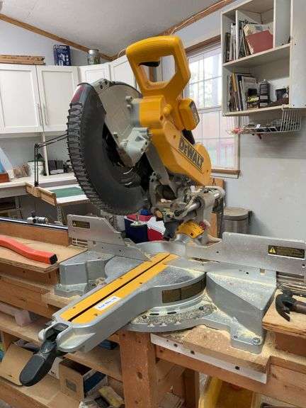Dewalt XPS Crosscut positioning system bolted on rolling table