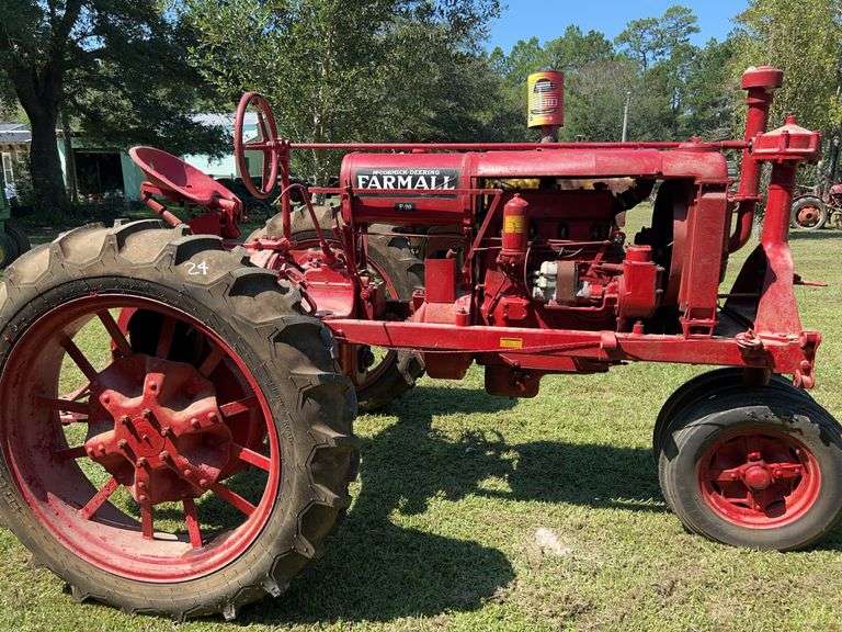 Red Farmall F-series row-crop tractor with red spoke wheels, John Borne Estate antique tractor auction